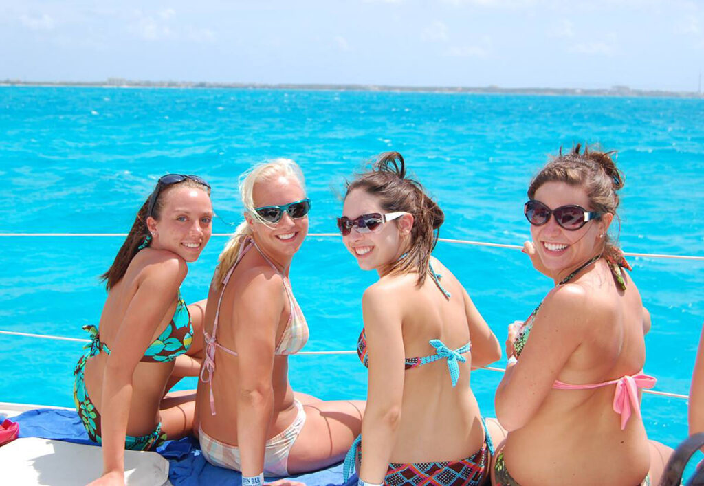 women on catamaran 1 cancun isla mujeres riviera maya catamarans
